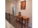 Hallway with wooden table and artwork at 101 Dewey Rd, Lilburn, GA 30047