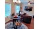 Open-concept living room with comfortable seating, TV, and bright natural light at 101 Dewey Rd, Lilburn, GA 30047