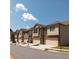 Row of modern townhomes with neat landscaping and 'Open House' signs at 101 Dewey Rd, Lilburn, GA 30047