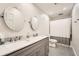 Modern bathroom with double vanity, gray cabinets, and shower with a curtain at 1080 Northshore Dr, Roswell, GA 30076