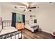 Shared bedroom featuring hardwood floors, two beds, and natural light at 1080 Northshore Dr, Roswell, GA 30076
