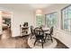 Inviting dining area featuring a round table and large windows offering natural light and outdoor views at 1080 Northshore Dr, Roswell, GA 30076