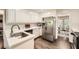 Kitchen featuring ample cabinetry, stainless steel appliances, and hardwood floors throughout at 1080 Northshore Dr, Roswell, GA 30076
