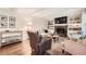 Relaxing living room features a fireplace, built-in shelving, and hardwood floors at 1080 Northshore Dr, Roswell, GA 30076