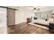 A view of the main bedroom and bathroom featuring a large bed and a barn door at 1080 Northshore Dr, Roswell, GA 30076