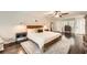 Spacious main bedroom featuring a ceiling fan, hardwood floors, and a large bed at 1080 Northshore Dr, Roswell, GA 30076