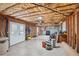 Unfinished basement with exposed ceiling and concrete floor. Includes door to outside at 1420 Arblay Pl, Loganville, GA 30052