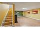 Finished basement featuring stairway and bright yellow walls at 1420 Arblay Pl, Loganville, GA 30052