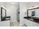 Modern bathroom with double vanity, granite countertop, and a glass enclosed shower at 1420 Arblay Pl, Loganville, GA 30052