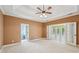 Bright and airy bedroom with trey ceilings and French doors leading to a sunroom and access to the ensuite at 1420 Arblay Pl, Loganville, GA 30052