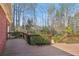 Multi-level wooden deck with stairs leading to the landscaped backyard at 1420 Arblay Pl, Loganville, GA 30052