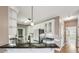 Charming kitchen features granite countertops, white cabinetry, and modern stainless steel appliances at 1420 Arblay Pl, Loganville, GA 30052