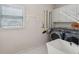 Laundry room with a washing machine and dryer, storage and sink at 1420 Arblay Pl, Loganville, GA 30052