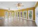 Spacious sunroom features tile floors, bright windows, and natural lighting at 1420 Arblay Pl, Loganville, GA 30052