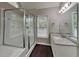 Modern bathroom with glass shower and vanity with granite countertops at 2001 Fairbrook Ln, Woodstock, GA 30189