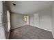 Spacious bedroom with neutral walls, plush carpeting and a sunlit window for a bright, airy feel at 2001 Fairbrook Ln, Woodstock, GA 30189