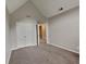 Neutral-toned bedroom with carpeting and a double door closet at 2001 Fairbrook Ln, Woodstock, GA 30189
