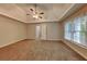 Large main bedroom featuring a ceiling fan, neutral color palette, and carpeting at 2001 Fairbrook Ln, Woodstock, GA 30189