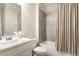 Clean bathroom with shower-tub combo, neutral color palette, and modern fixtures at 2622 Running River Ct, Lawrenceville, GA 30045