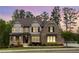 Charming brick and siding home with a welcoming front porch and meticulously landscaped front yard at 2622 Running River Ct, Lawrenceville, GA 30045