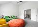 Bright living area featuring stylish seating arrangements, a large beanbag, and a view to the stairway at 2622 Running River Ct, Lawrenceville, GA 30045