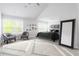 Spacious main bedroom with high ceilings, large mirror, and natural light at 2622 Running River Ct, Lawrenceville, GA 30045