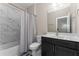 Well-lit bathroom with a bathtub/shower combo and vanity, providing a functional and stylish space at 380 Parkside Meadow Dr, Marietta, GA 30064