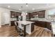 Bright kitchen with a large island, stainless steel appliances, and tile backsplash at 380 Parkside Meadow Dr, Marietta, GA 30064