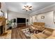 Cozy living room with a stone fireplace, modern furnishings, and hardwood flooring at 380 Parkside Meadow Dr, Marietta, GA 30064
