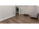 Bright living room featuring wood floors, an inviting seating area, and French doors to a green space at 380 Parkside Meadow Dr, Marietta, GA 30064
