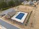 Aerial view of the community pool, playground, parking lot, and surrounding greenery at 380 Parkside Meadow Dr, Marietta, GA 30064