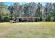 Wide angle shot of barn and equipment stored there; open green space at 1621 Dixie Rd, Covington, GA 30014