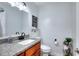 Charming bathroom featuring a granite countertop and decorative accents at 1621 Dixie Rd, Covington, GA 30014