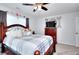 Inviting bedroom with a comfy bed, TV, plush rug, and a ceiling fan at 1621 Dixie Rd, Covington, GA 30014