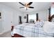 Bedroom with a queen bed, ceiling fan, and windows with lots of light at 1621 Dixie Rd, Covington, GA 30014