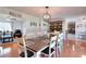 Elegant dining room featuring a large table, stylish lighting, and seamless access to living areas at 1621 Dixie Rd, Covington, GA 30014