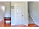 Inviting entryway with a bench and sign, leading to the staircase at 1621 Dixie Rd, Covington, GA 30014