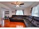 Spacious living room with hardwood floors, a large sectional sofa, and ample seating at 1621 Dixie Rd, Covington, GA 30014