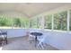 Enclosed screened porch with ample light, views, and space for seating at 1621 Dixie Rd, Covington, GA 30014