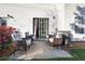 Back patio with seating area and outdoor lighting at 210 Cottonwood Creek Cir, Canton, GA 30114