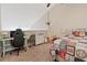 Cozy upstairs bedroom with a sloped ceiling and carpet at 210 Cottonwood Creek Cir, Canton, GA 30114