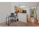 Bright kitchen with modern appliances, a breakfast bar, and a view of the entryway at 210 Cottonwood Creek Cir, Canton, GA 30114