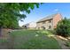 Expansive backyard with lush lawn and mature trees, perfect for outdoor activities at 211 Parc Dr, Canton, GA 30114