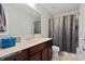Bathroom with shower-tub combo, single-sink vanity with granite countertop, and tile flooring at 211 Parc Dr, Canton, GA 30114