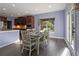 Dining area offers a wooden table and chairs with outdoor views from the backyard at 211 Parc Dr, Canton, GA 30114