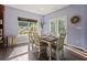 Dining area with backyard views and a white wooden table and chairs at 211 Parc Dr, Canton, GA 30114