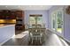 Well-lit dining area features a wood table and chairs with glass doors leading to the backyard at 211 Parc Dr, Canton, GA 30114