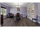 Formal dining room featuring elegant chandelier, large window, and a built-in bookcase at 211 Parc Dr, Canton, GA 30114