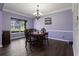 Dining area featuring traditional chandelier and large window for natural light at 211 Parc Dr, Canton, GA 30114