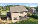Back of home featuring a patio, shed, and a lush green lawn, perfect for relaxation and outdoor activities at 211 Parc Dr, Canton, GA 30114